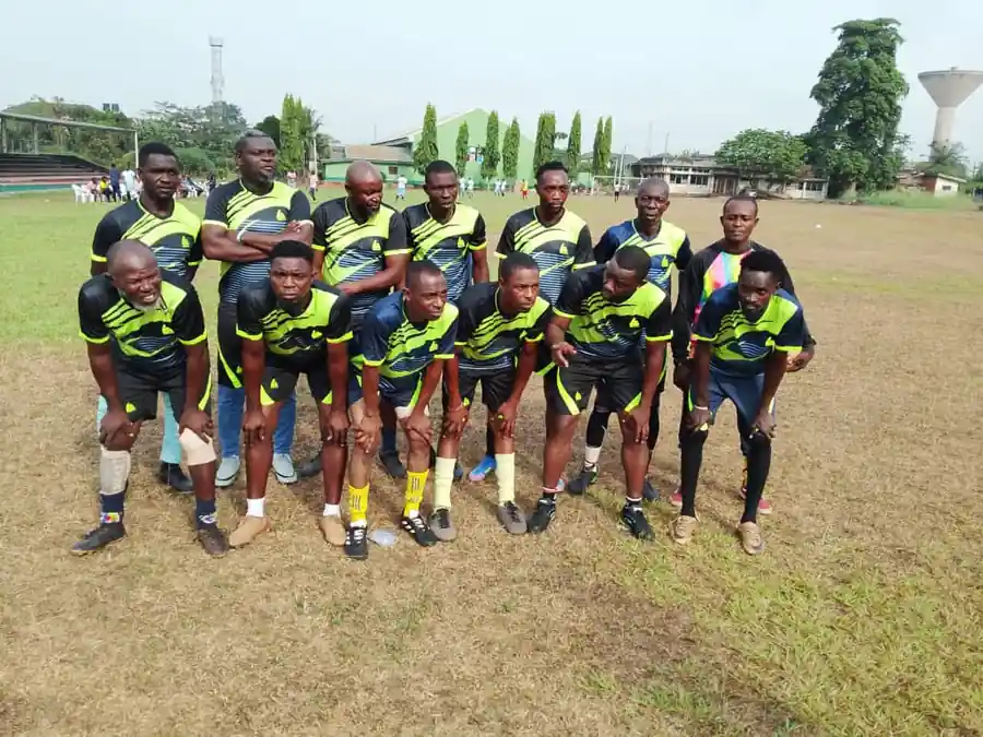 The Edogram football team in their kit on the school field