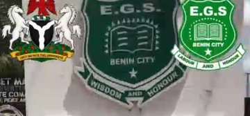The crests on the school signboard, First Federal Road